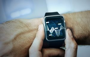 man-checking-summary-data-his-smartwatch