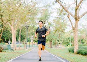 vecteezy_happy-healthy-asian-man-running-in-the-park-in-morning_1270258
