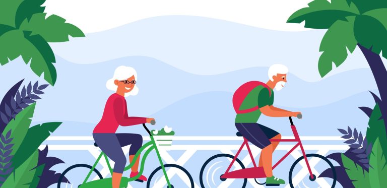 A joyful senior couple biking outdoors, exemplifying healthspan enhancement through advancements in longevity research and active lifestyle.