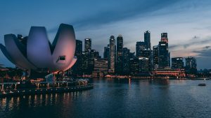 Night view of Singapore's skyline, reflecting its new status among the world's Blue Zones for longevity, health, and happiness.
