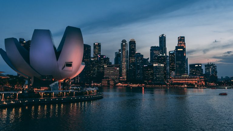 Night view of Singapore's skyline, reflecting its new status among the world's Blue Zones for longevity, health, and happiness.